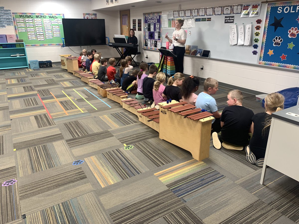 Learning across classrooms today - readers, artists, musicians and preschool light exploration.