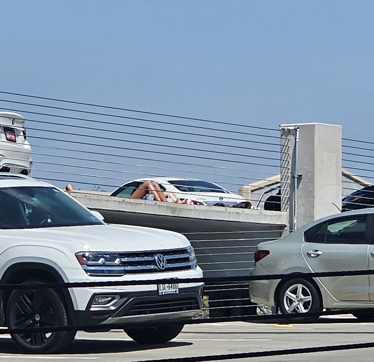kylemers's tweet photo. Sunbathing on the roof of a parking garage #oklahomamoment #boringashell https://t.co/g2igQRMj6S