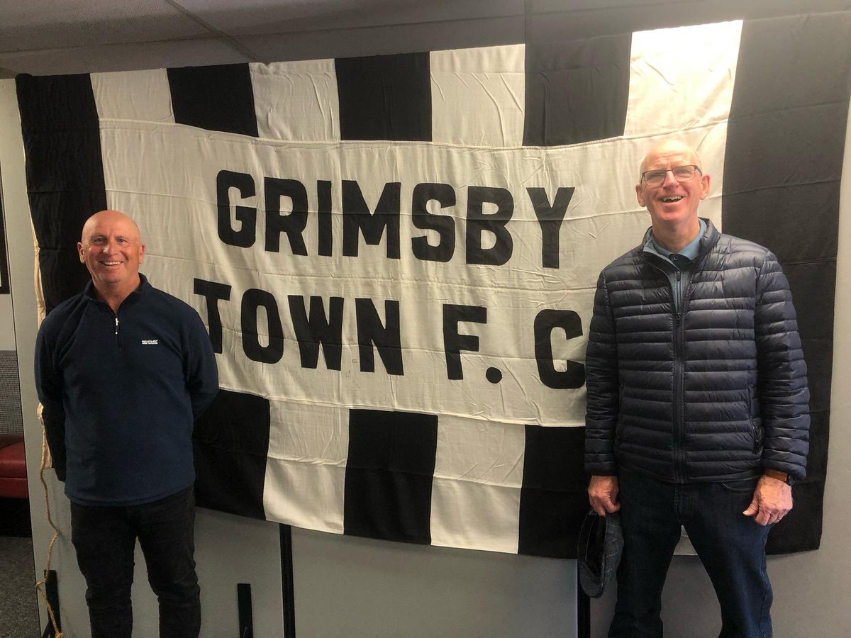 KeeleyDonovan's tweet photo. Here’s my brilliant Dad &amp; his best mate Paul enjoying the Grimsby Town Foundations Heritage Project’s exhibition. It continues in the Lower Bar for the next week or so. Facts, stats, photos &amp; other items of memorabilia. https://t.co/wZ5Hr9daaR https://t.co/6m2P3gJ9lu