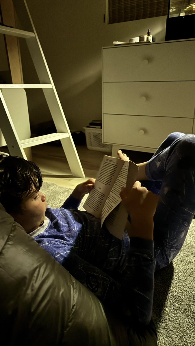 My 9 year old locked in…reading the Art of the Deal