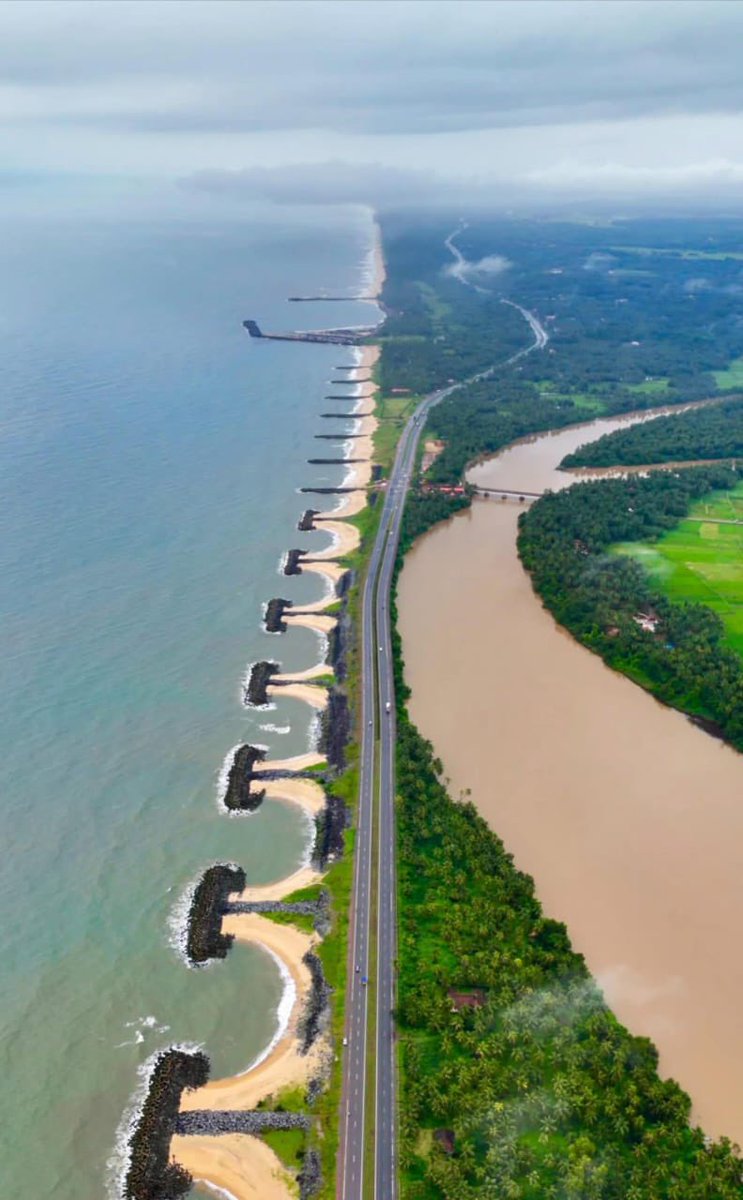 wanderwithsky's tweet photo. The road that made me stop and just breathe.
Maravanthe Beach, Karnataka-oceans on one side and backwaters on the other. Wild winds &amp; endless sky. 
Nature couldn’t decide what it loved more-land or water.
I stood there, caught in between.
Ever found a place that made time pause? https://t.co/YyAksDLlNW