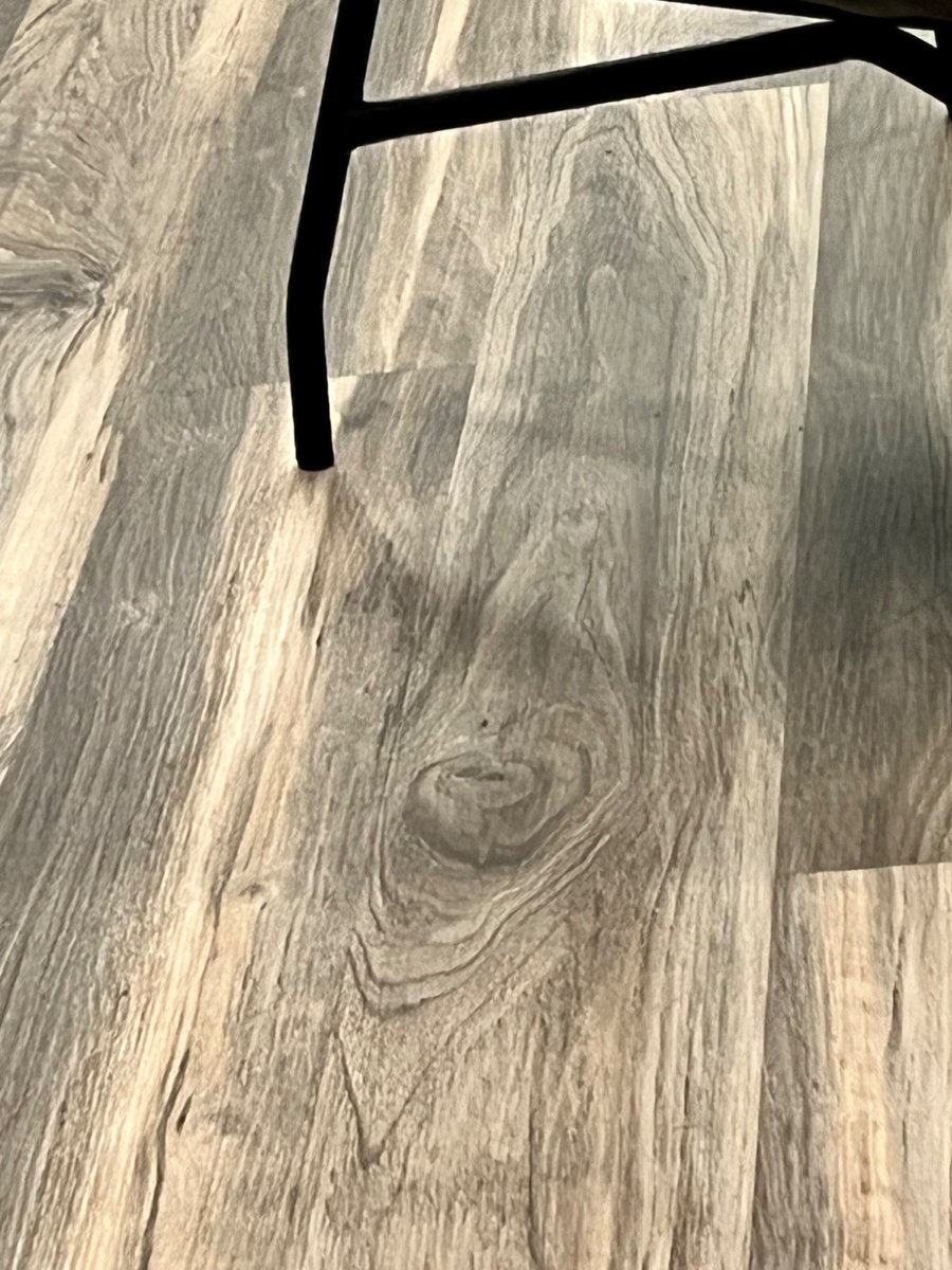Anyone else see someone trapped in this wood floor?
