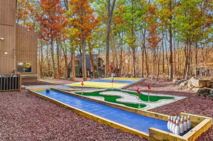 AdvntureCapital's tweet photo. This Poconos property just got a major backyard glow-up! ✨ Pickleball + basketball court, pool &amp; deck, fire pit, jungle gym, bowling, mini golf, cornhole &amp; hot tub — it’s a full-on resort at home! 

#PoconosLiving #OutdoorOasis #BackyardGoals #PoolsideVibes #DreamBackyard https://t.co/heNAUygSIZ
