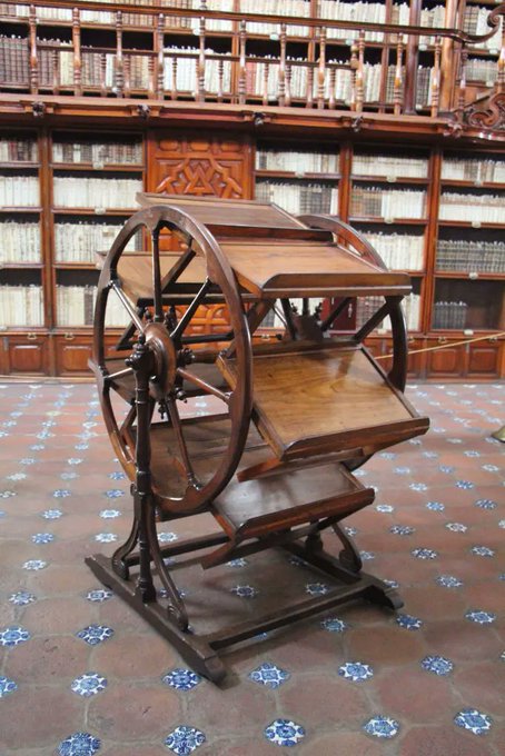 Rainmaker1973's tweet photo. This is a 300-year-old book wheel kept in the Biblioteca Palafoxiana, Puebla, Mexico: it allowed 18th century researchers to have up to seven books open at once.

A kind of analog of today's multi-tab browsers. https://t.co/lrHfrmpU1P
