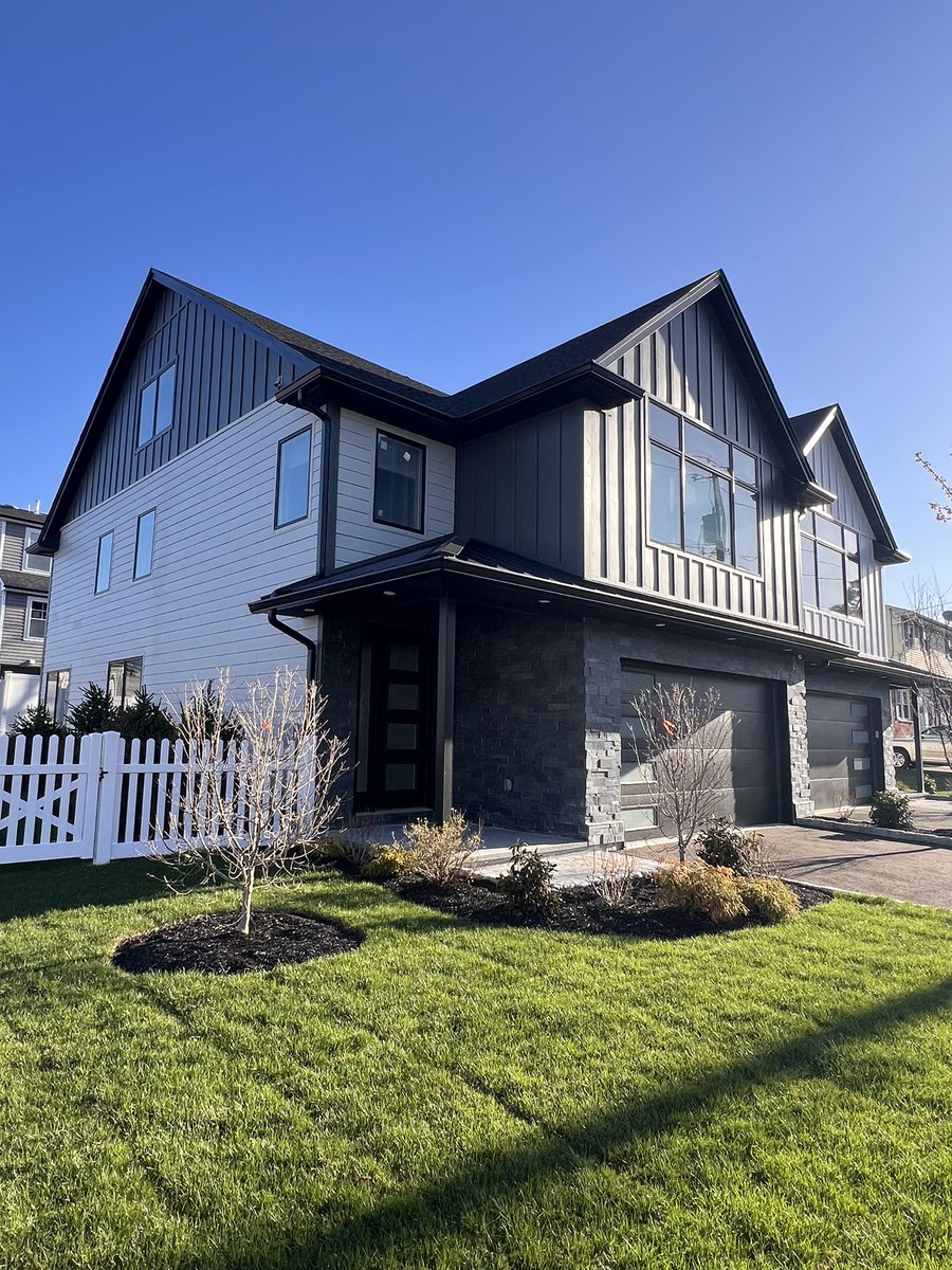This beautiful duplex received @jameshardie siding and trim with horizontal planks and board &amp; batten style. Different colors for particular sections adds character to this project. #hardieplank #hardieplank #duplex #siding #sidingcontractor