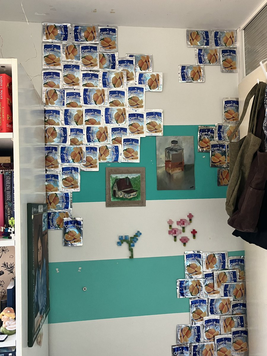 PopCorn__G's tweet photo. How my Caprisun wall looks like now! they’re slowly falling off so in the empty spots i decided to hang some art! 
to believe that it was once the full wall is crazy 
(all caprisun packages that have fallen are being thrown away) https://t.co/zoLofueTvV