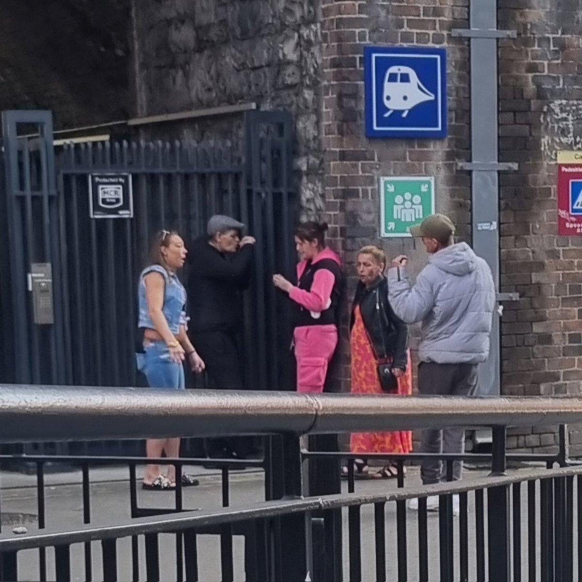 hansmolemann's tweet photo. @IrishRail 

Right now, outside the back entrance to Tara Street Station. 
Gang of people smoking
substances.

This happens every single day I use this station. I have complained on numerous occasions. The lack of accountability from Irish Rail is pathetic https://t.co/ZYWQWPh7Kw