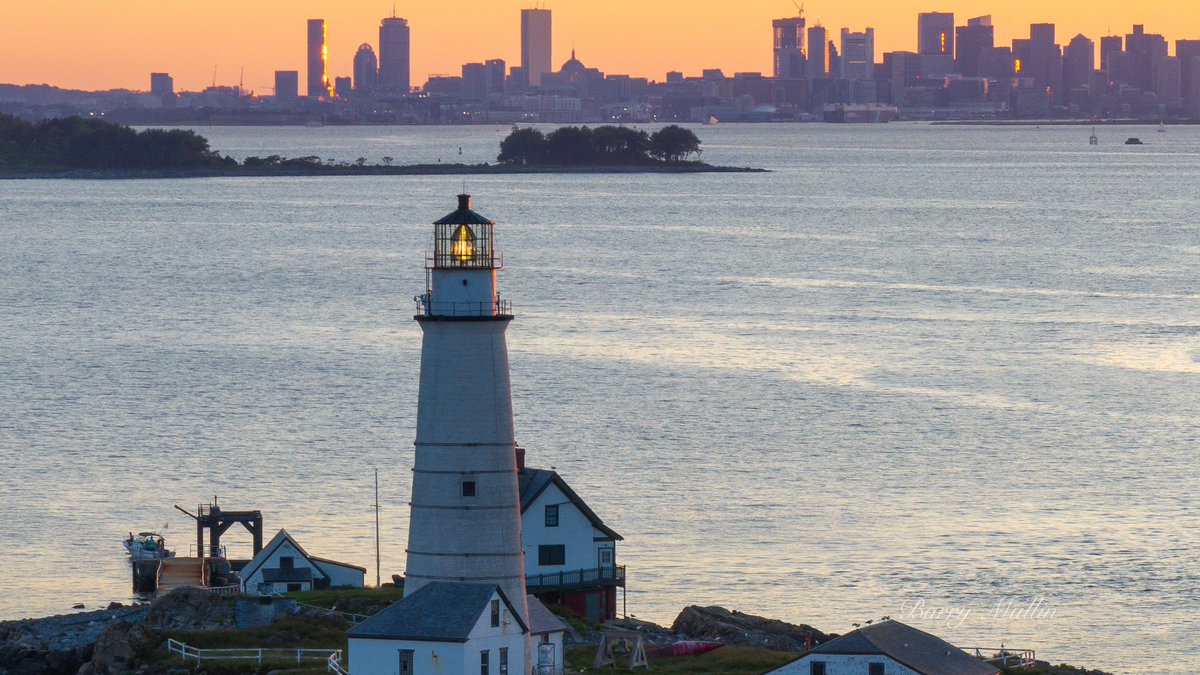 Boston Light during sunset with the City of Boston in the background 

<a href="/StormHour/">#StormHour</a> <a href="/ThePhotoHour/">#ThePhotoHour</a>