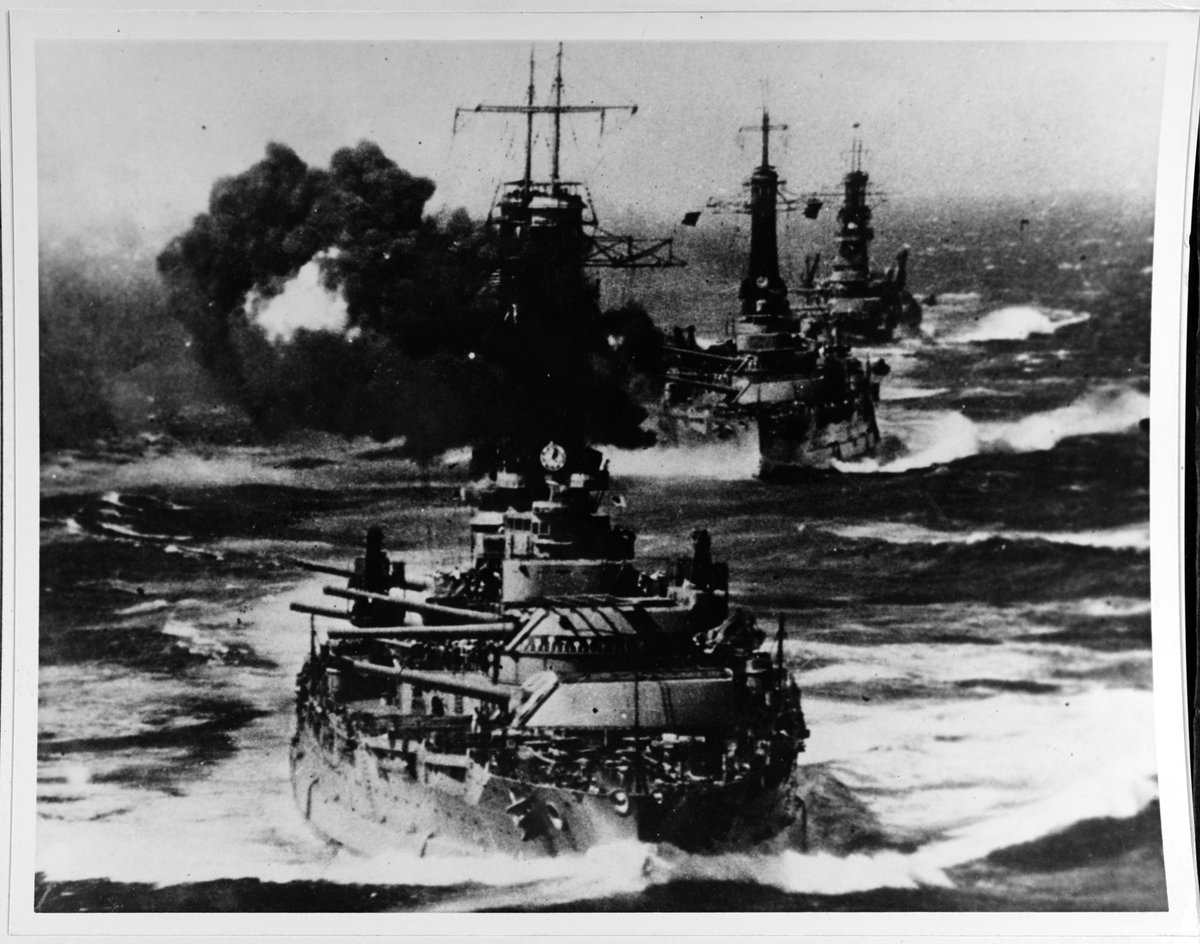 Battleships of the Pacific Fleet conduct battle practice, likely during fleet maneuvers off San Francisco in 1920. 

The battleship USS New York is leading the formation, followed by her sister USS Texas. The battleship USS Wyoming is bringing up the rear of the formation.
