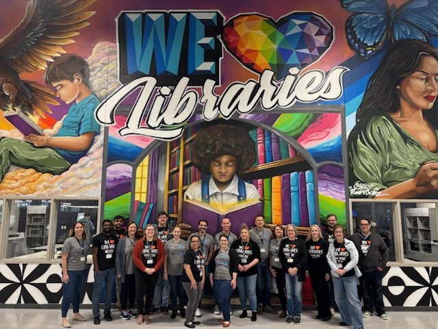 📚 Happy National Library Week! 📚

Here's a snapshot of a few of our team members gathered in front of our "We Love Libraries" mural, because we truly do! 📚😊