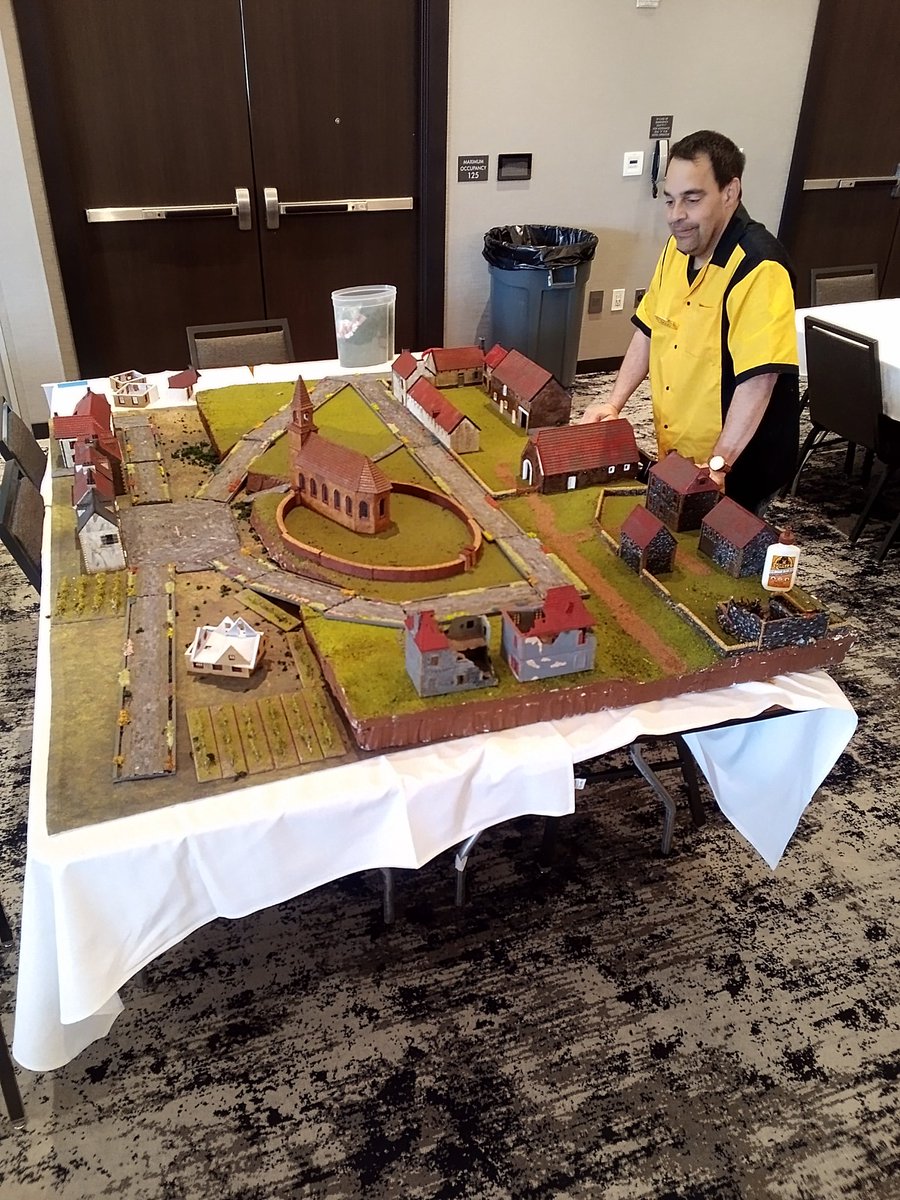 WargameCulture's tweet photo. Doug from Mark's Game Room is setting up for his Napoleonics game.

Rebels &amp; Patriots skirmish rules.

"Defense of Plancenois"
#MayhemCon @mfastoso https://t.co/0xKPd7uMap