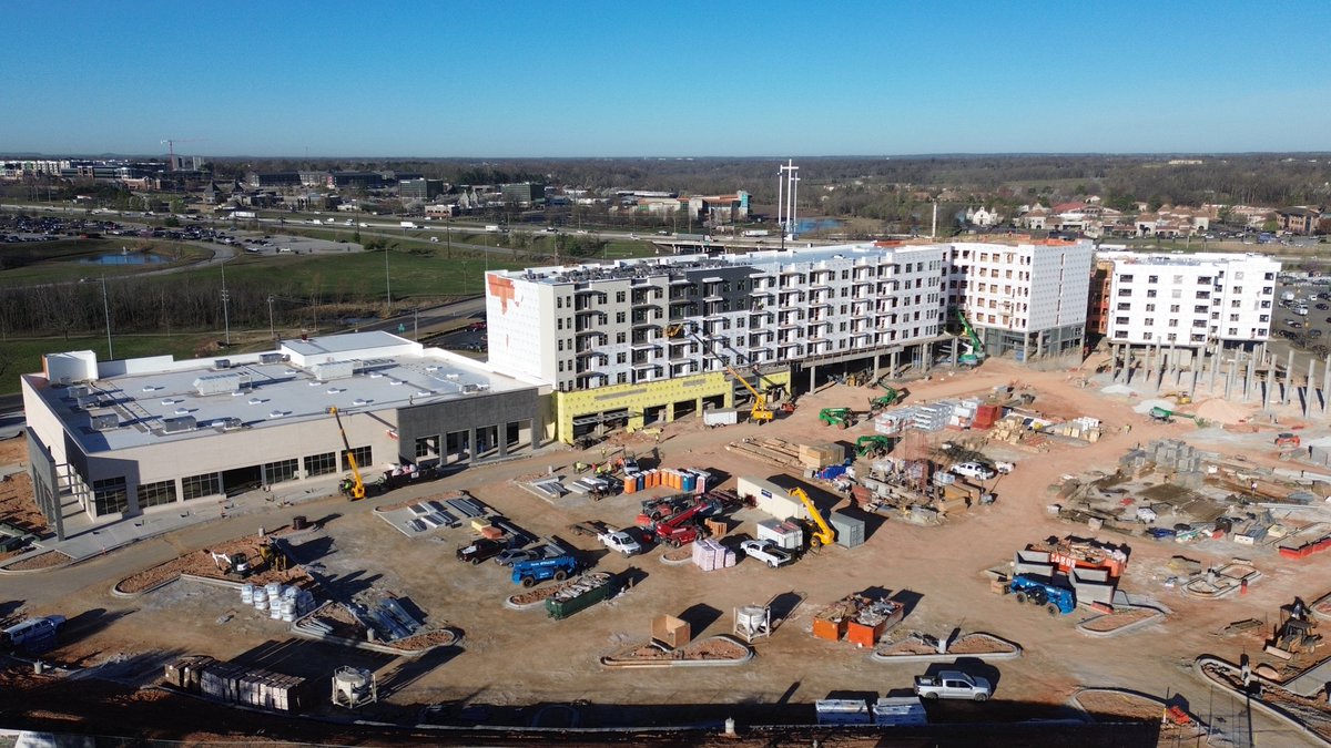 Exciting progress at our Pinnacle Springs project in Northwest Arkansas! We’re wrapping up the final deck pours, preparing to turn over the Whole Foods space for TI finish-out, &amp; painting has begun on the multifamily units while framing continues. Stay tuned for more milestones!