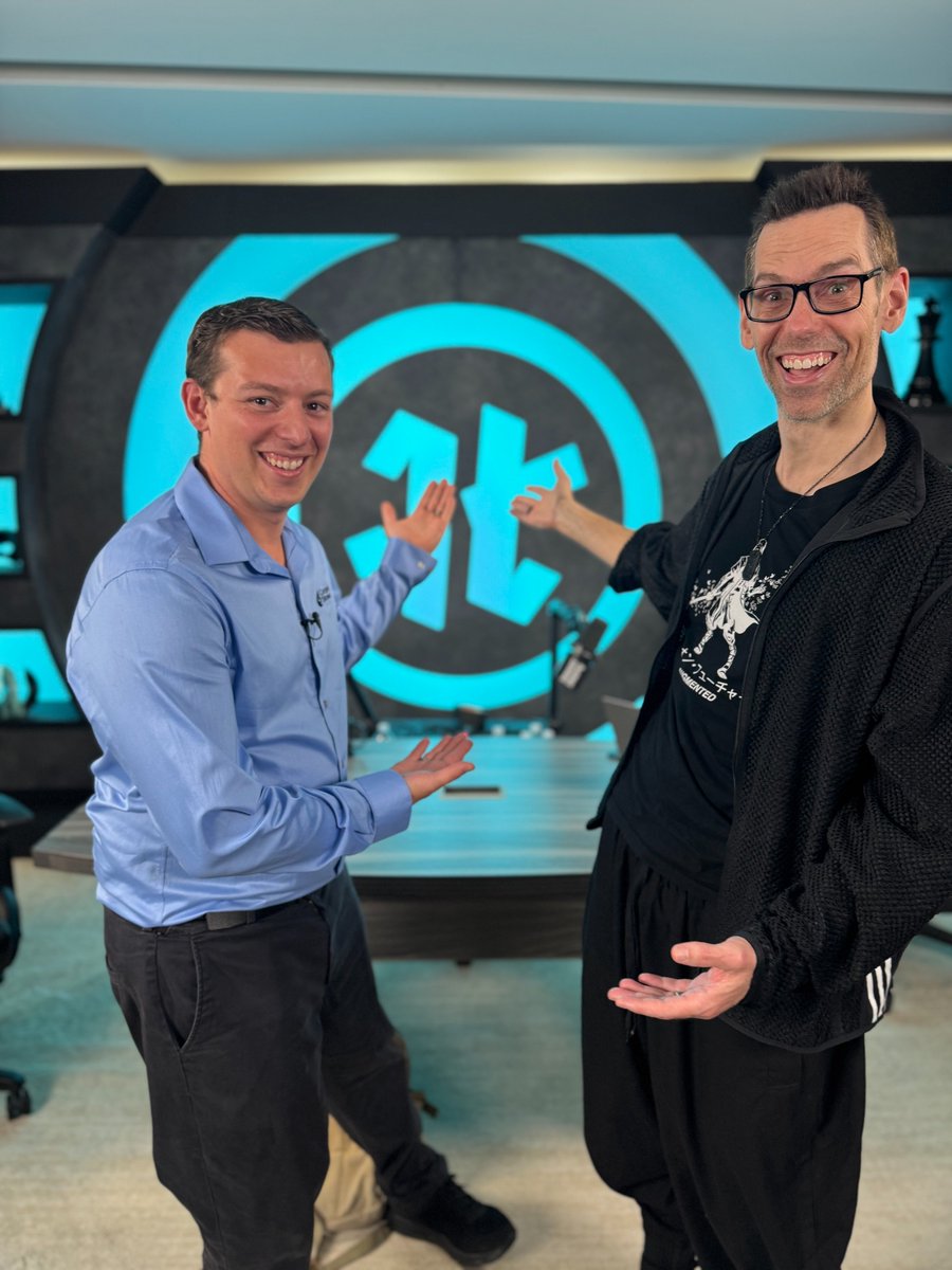 CorporateStrea1's tweet photo. Smiling with my mentor @TomBilyeu in front of the Impact Theory logo—a symbol of growth and grit. Tom, your work has transformed me as a person and entrepreneur. Grateful for the tour, the pics, and the chance to see your mission up close. https://t.co/sHDLL9sXtT