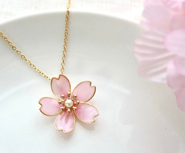 He hands her a small box for her to open. Once she does, she'll find a gold necklace with a silver and gold cherry blossom with a rare pearl in the middle of it.

〝 Happy birthday, stinky cousin. 〞