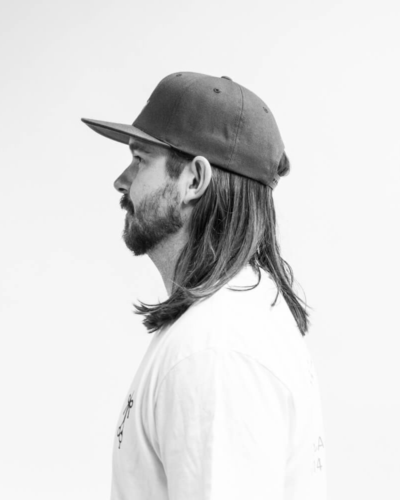 THE TUCK - A reliable go-to for many guys, where the hair is tucked behind the ears. *Can be misconstrued for a mullet.