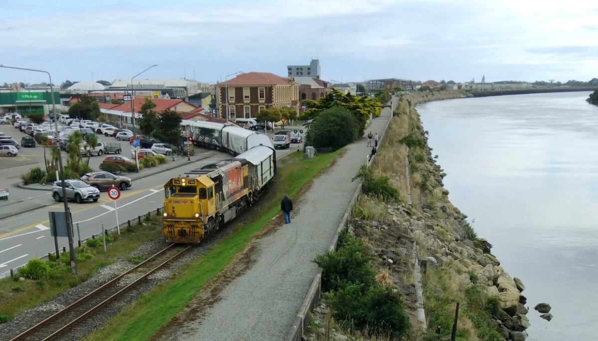Greymouth, 1981 &amp; today. Where the railway line once branched down the riverbank to the coal wharf is now the Floodwall, built after the 1988 floods.

The Tranzalpine was leaving when I took todays photo &amp; the Rewanui miners train is at the old Riverside Station in the 1981 shot