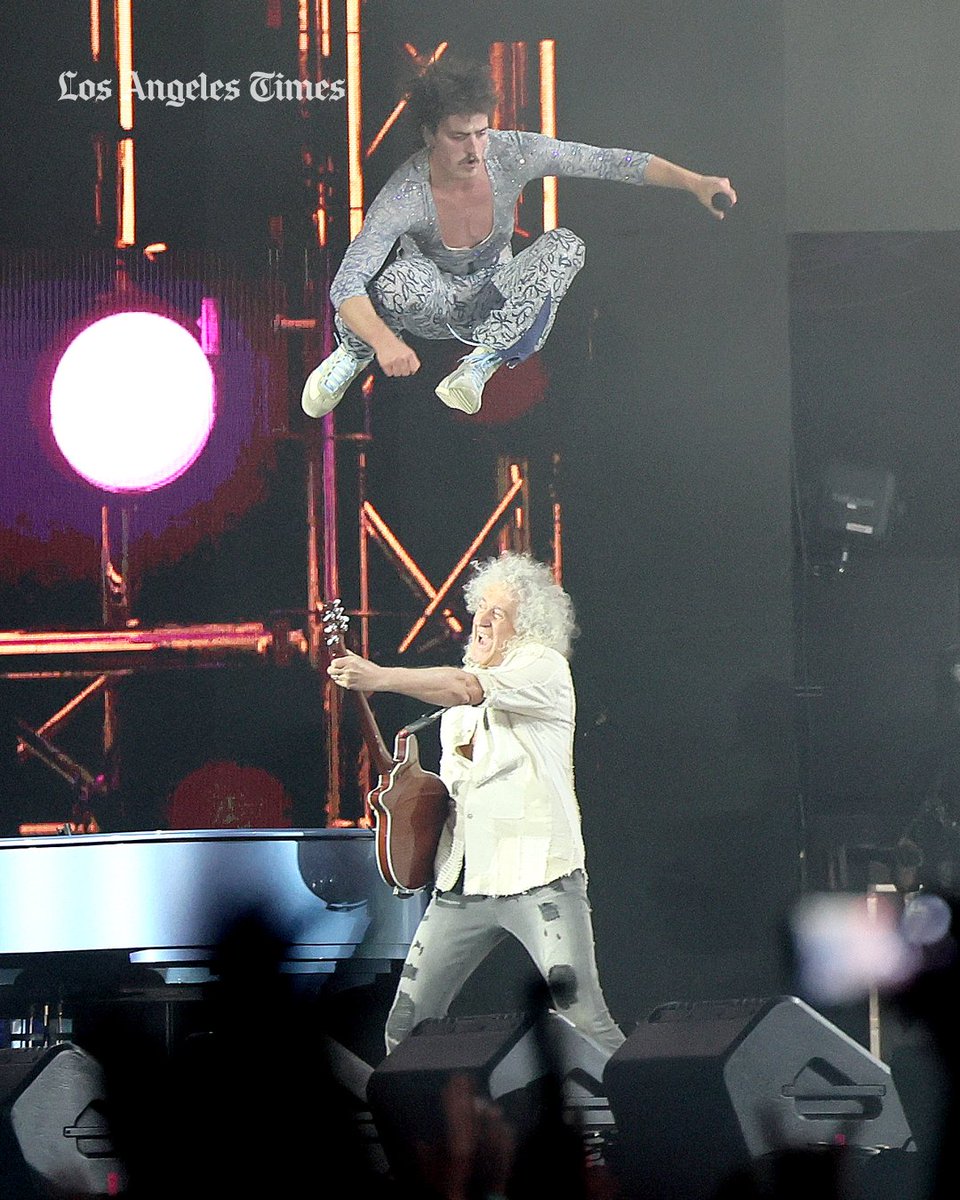 latimes's tweet photo. Benson Boone jumped over Queen's Brian May at #Coachella. See more of Allen J. Schaben's photos from day one: https://t.co/9DdUTN6RFt https://t.co/5l1mLNmpl4