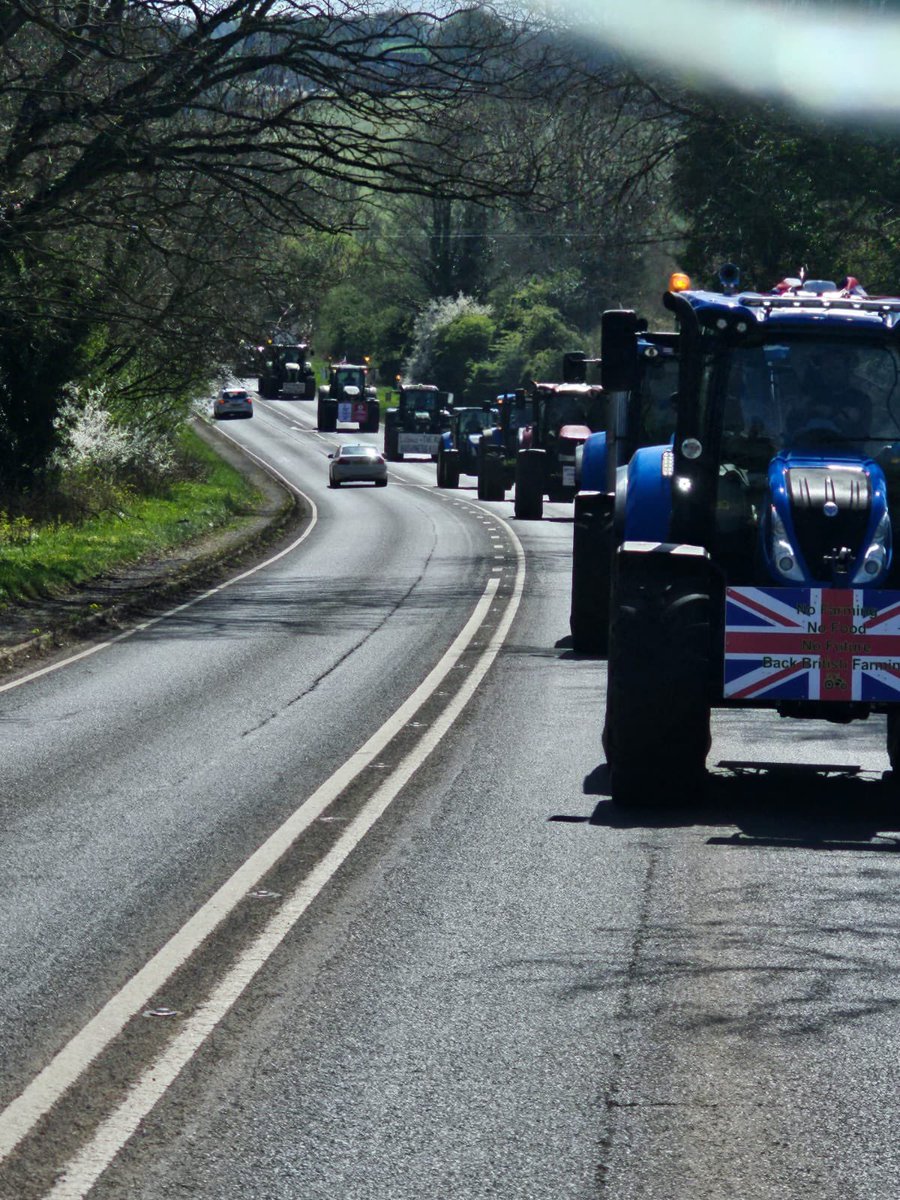 FarmingUK's tweet photo. Farmers on their way to Banbury, rallying against unpopular government policies such as the inheritance tax! 🚜 🪧 

📸 @FarmersToAction https://t.co/hhRP1cbCcq