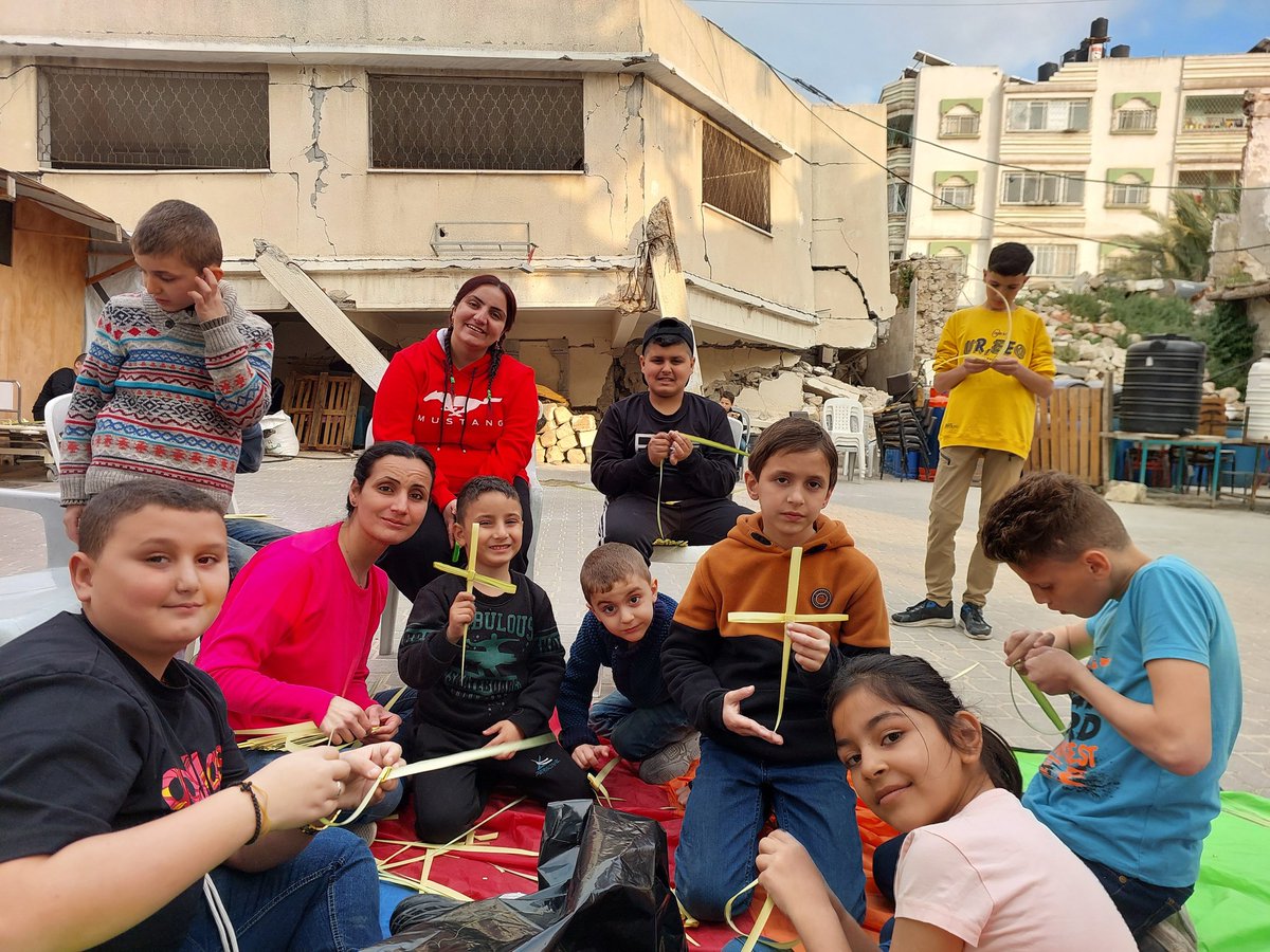 JehadAbusalim's tweet photo. Saint Porphyrios Orthodox Church in Gaza shared these photos yesterday. They show Palestinian Christians in Gaza celebrating Palm Sunday. This 1,600-year-old church is one of the oldest in the world. It was built in 425 AD.