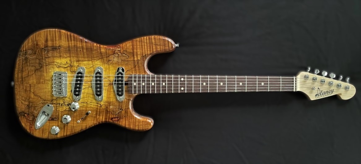 It's Day 12 of International Guitar Month! We're celebrating the best way we know how to, with photos of some of our favorite guitar builds. Here's the latest installment.
A Delaney "Austin" with some of the nicest spalted/figured maple capping the body. Fitted with Delaney