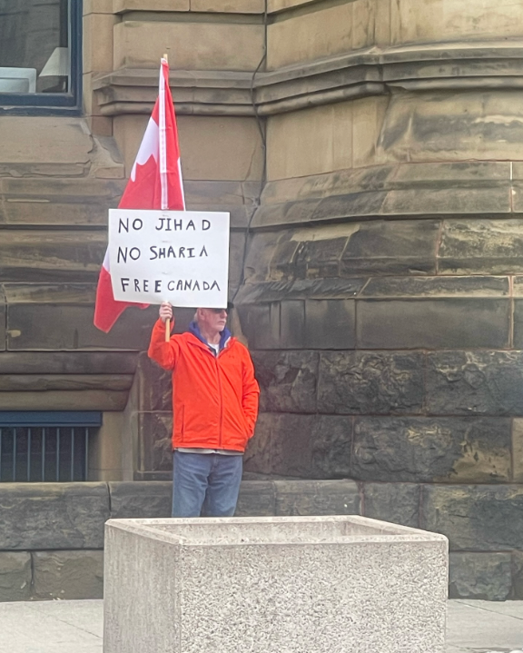 l3v1at4an's tweet photo. Canadian Patriot standing alone in Ottawa during the Hamas National March. 

Where are the many others like him?? https://t.co/vhEfeIuYkv