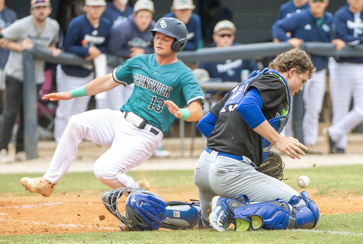 Pitt freshman catcher Patrick Boldt retrieves the ball as Brenner Gursky scores for BCC in the second game of the doubleheader Saturday at Founders Field. Boldt, a former South Brunswick player, entered the game with an on-base average of .580, second highest among the Bulldogs.