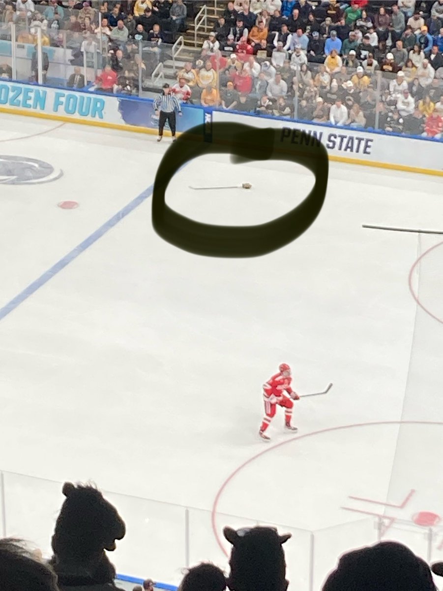 Amalthea13's tweet photo. This game’s crazy! They just left a stick and glove on the ice and play around it.
#MFrozenFour https://t.co/TpNrU3qUkO