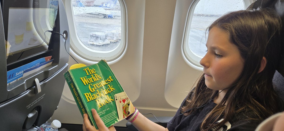 10-yo daughter also ready for her flight.  Her carry on bag contained only this book and sour skittles.