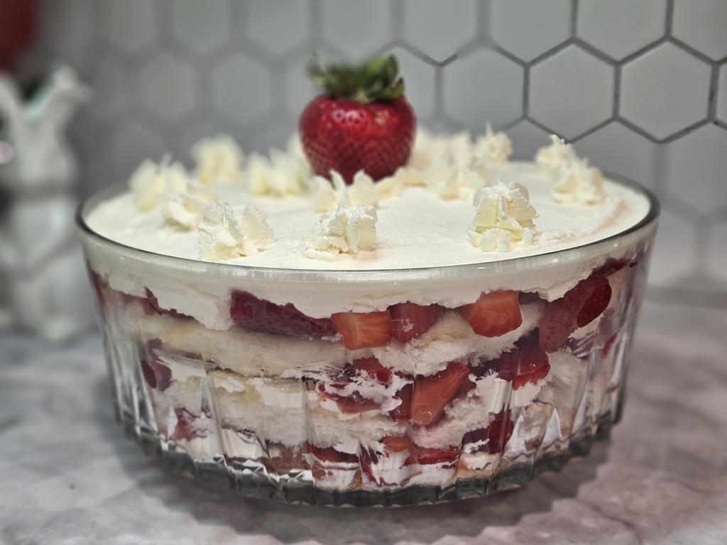 Mom made this for her grandaughter's first birthday party today. It's 3 layers of angel food cake, strawberries, and marscapone whipped cream. 🍓