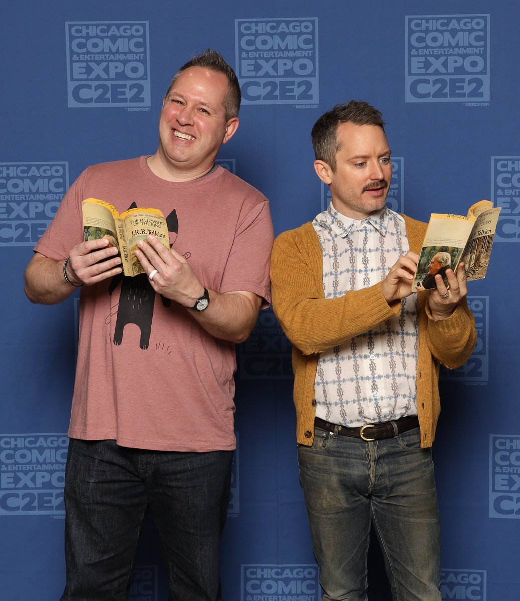 I was gifted a photo op with <a href="/elijahwood/">Elijah Wood</a> at <a href="/c2e2/">C2E2</a>. As a librarian, I thought it would be fitting for us to be reading my copies of #LOTR