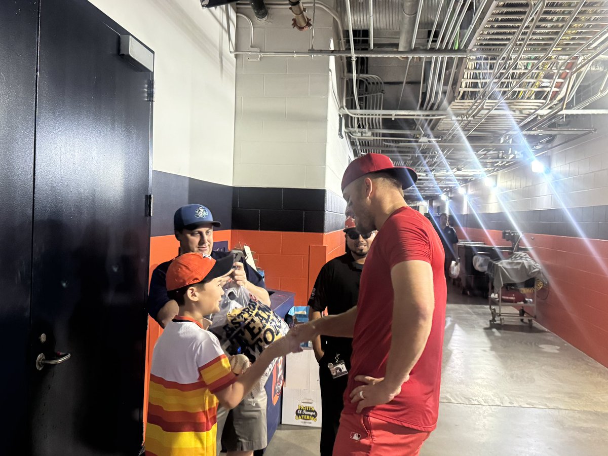 Mike Trout met with the fan who interfered with his catch attempt and signed the ball for his son