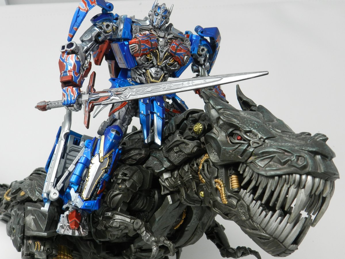 ChromeTyranno's tweet photo. "Transformers Studio Series - AOE/TLK  Optimus Prime" 
And on the third day he rose again.  Riding a giant T-Rex. 
(Retweets appreciated as always! :D) https://t.co/sSMvX4Bpju