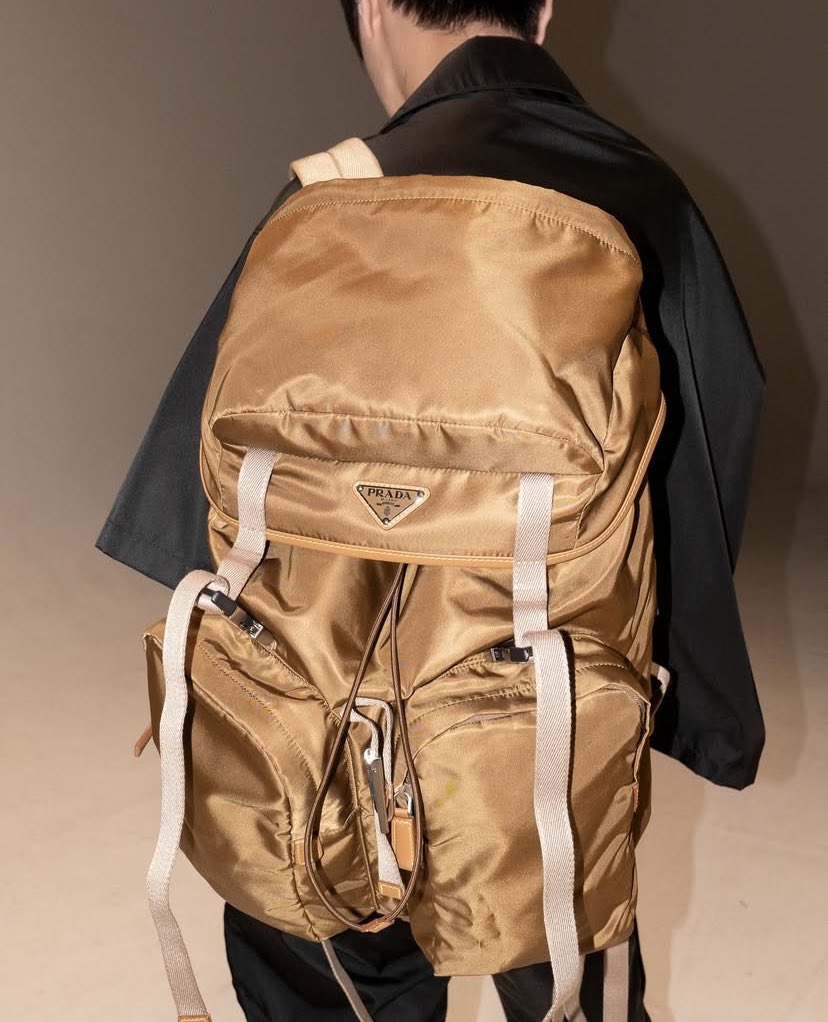 Every detail, from the crisp outfit to the way he holds the accessory, radiates refined style. It’s not just an endorsement, it’s a statement and he wears it like second nature.