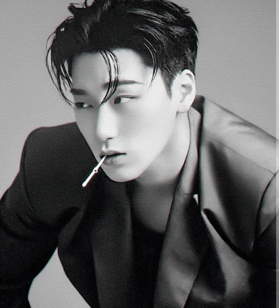 Watching some stupid behavior of people around him.