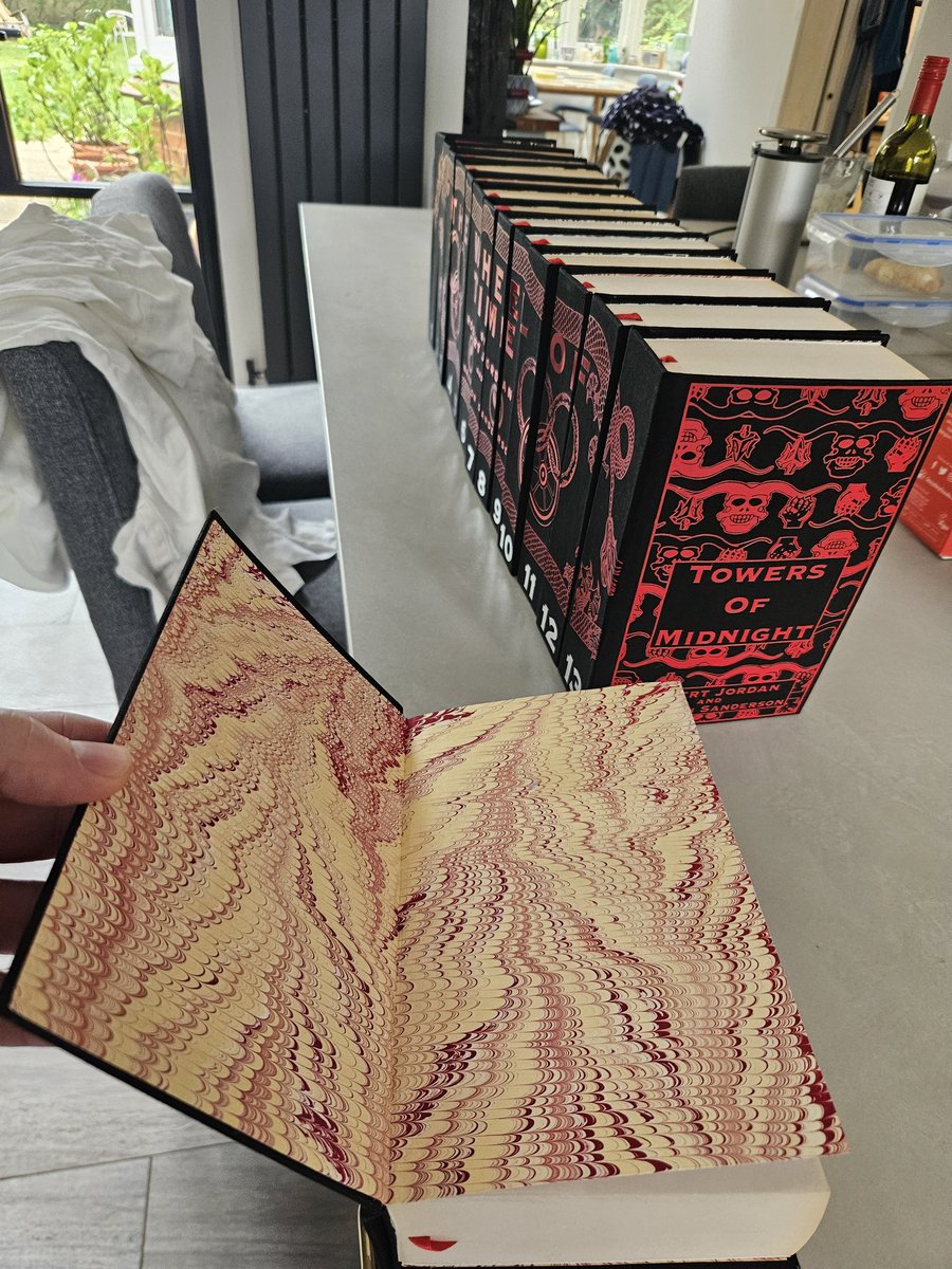 DomNeedler's tweet photo. My sister just finished rebinding my Wheel of Time paperbacks into hardback with fully custom designs as a birthday present... shes set the bar WAY too high 😂 https://t.co/ttkXIENgxU
