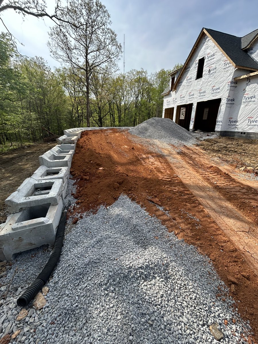Unplanned retaining wall:

Somebody (🙋) didn’t review elevations pre-construction but at least our dirt guy loves us.