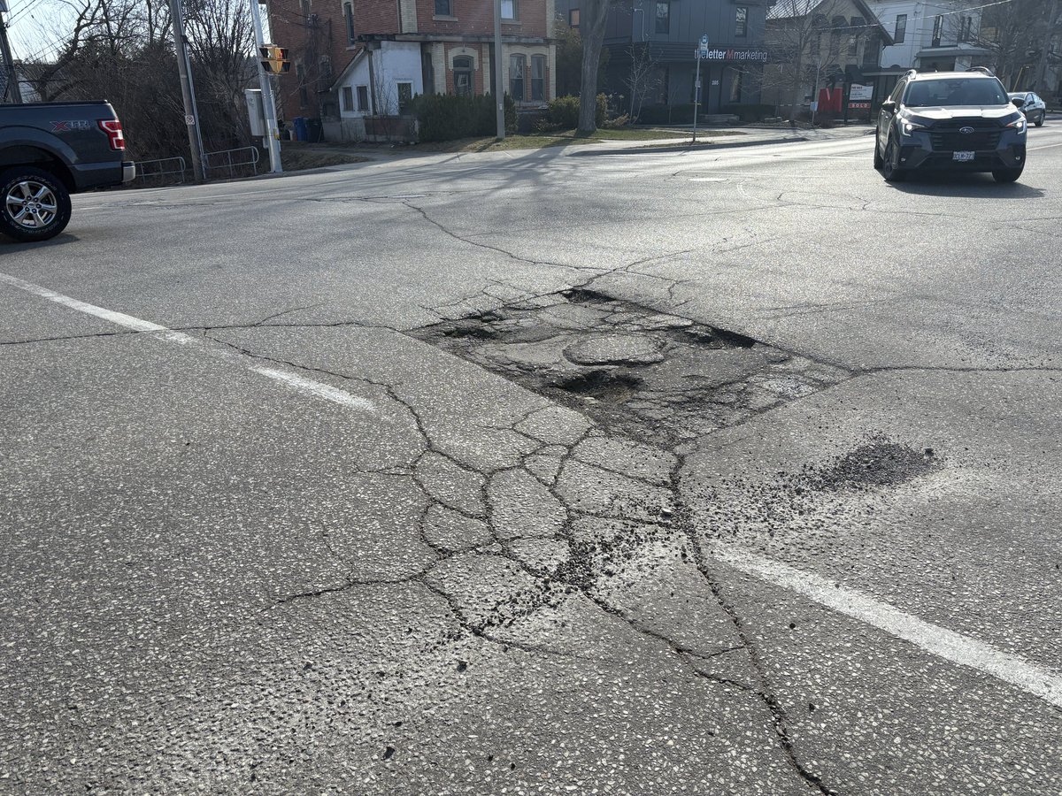 Another amazing pothole not being fixed…same every year and will remain a gong show at this dangerous junction forcing drivers and riders to serve at eachother..<a href="/cityofguelph/">City of Guelph</a>