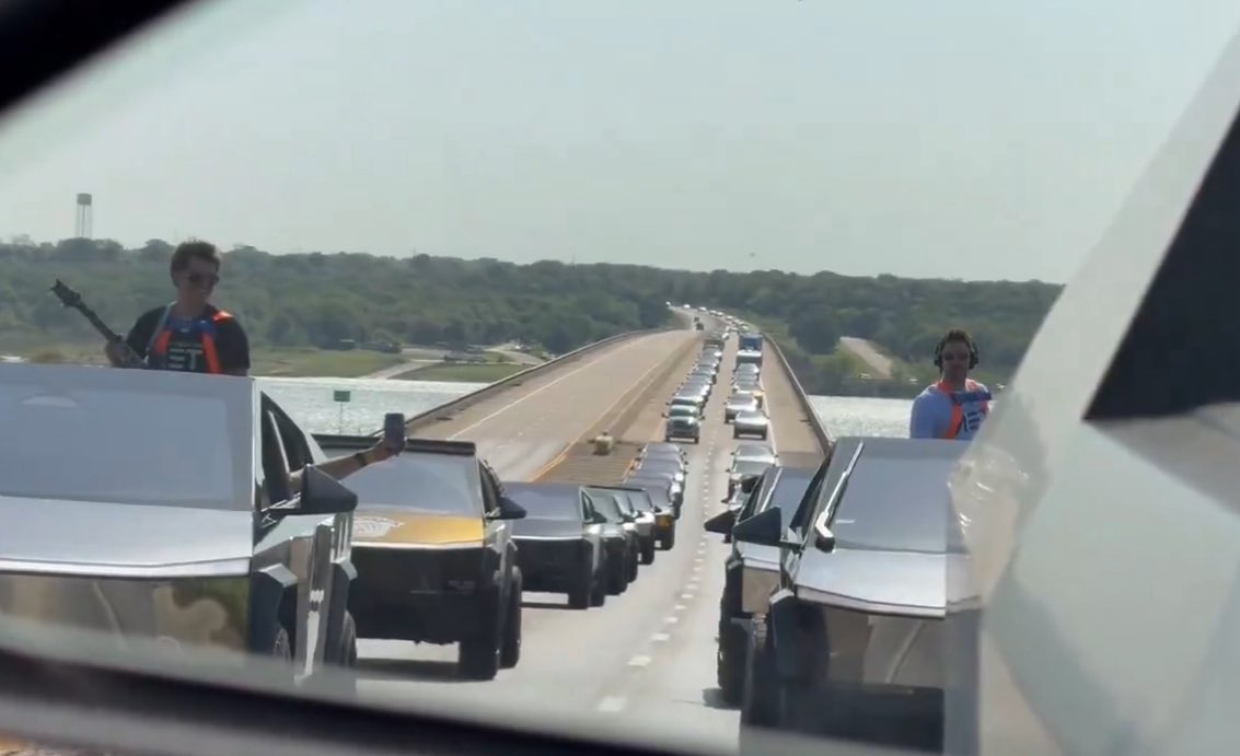 cybertruck's tweet photo. When the function has a mile of Cybertrucks > https://t.co/6PIHtHli3E