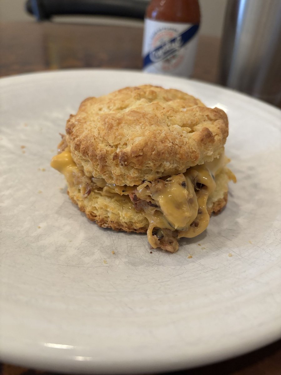 It's hard to top this hearty  #breakfastsando. Pulled pork and cheese on a homemade biscuit.