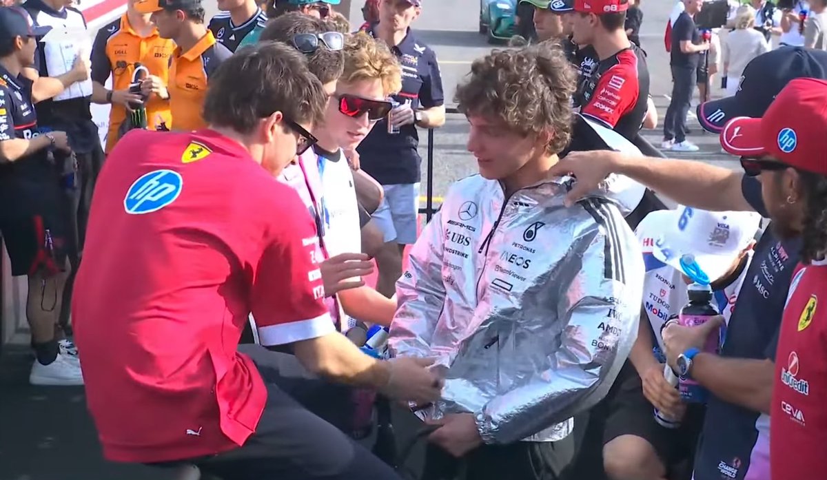 Vetteleclerc's tweet photo. Kimi wearing a jacket and Charles checking it lol https://t.co/3zrznJgsuT