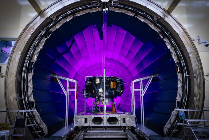 NASA’s IMAP mission being loaded into the thermal vacuum chamber of NASA Marshall Space Flight Center’s X-Ray and Cryogenic Facility (XRCF) in Huntsville, Alabama. A light in the back of the chamber illuminates purple.
Credit: NASA/Johns Hopkins APL/Princeton/Ed Whitman