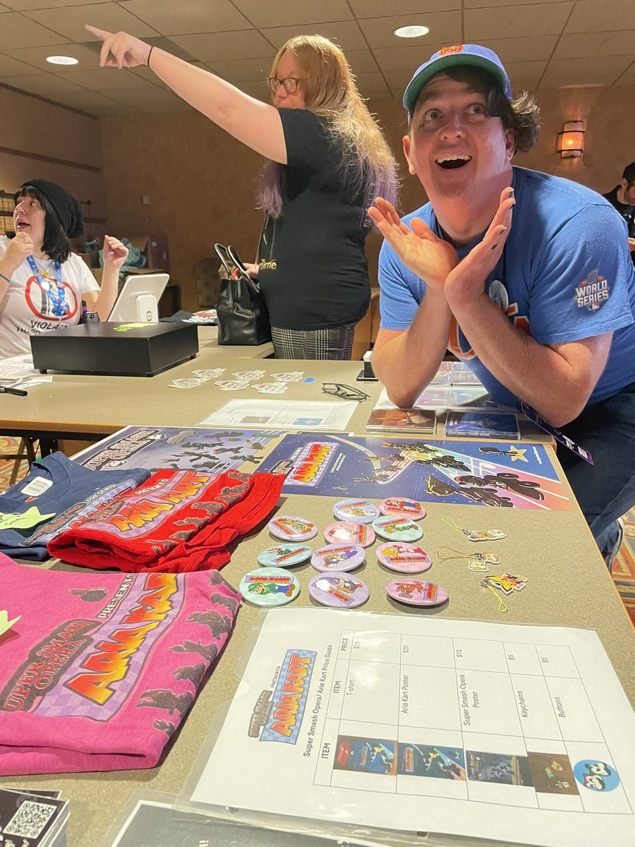 SuperSmashOpera's tweet image. We still-a have-a da mercha-a…. Yahoo! ARIA KART shirts, keychains and posters at the Boss Stage merch table before 3pm! Get them before they go back into the car and we say There we go! Much love to all who came to and participated in our show this weekend @VGMCon! #vgmcon2025