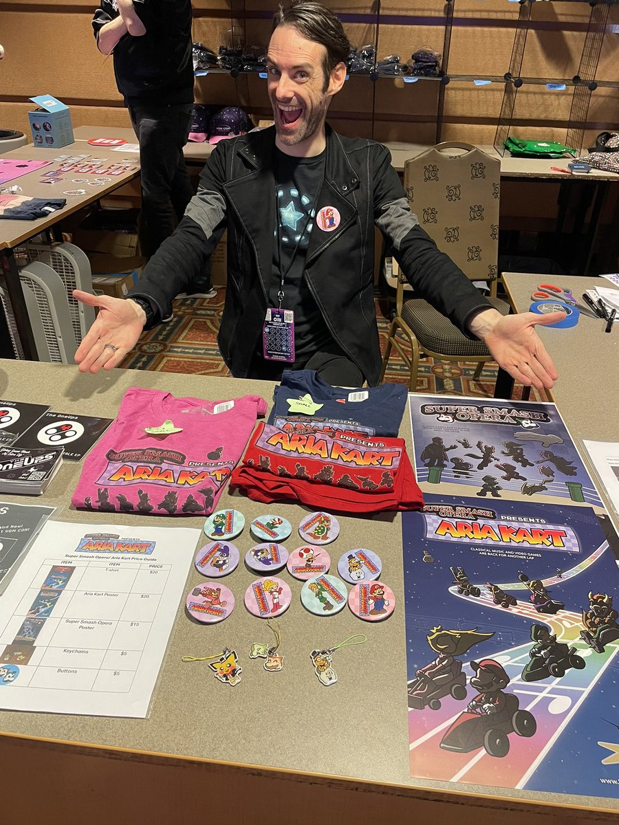 SuperSmashOpera's tweet image. We still-a have-a da mercha-a…. Yahoo! ARIA KART shirts, keychains and posters at the Boss Stage merch table before 3pm! Get them before they go back into the car and we say There we go! Much love to all who came to and participated in our show this weekend @VGMCon! #vgmcon2025