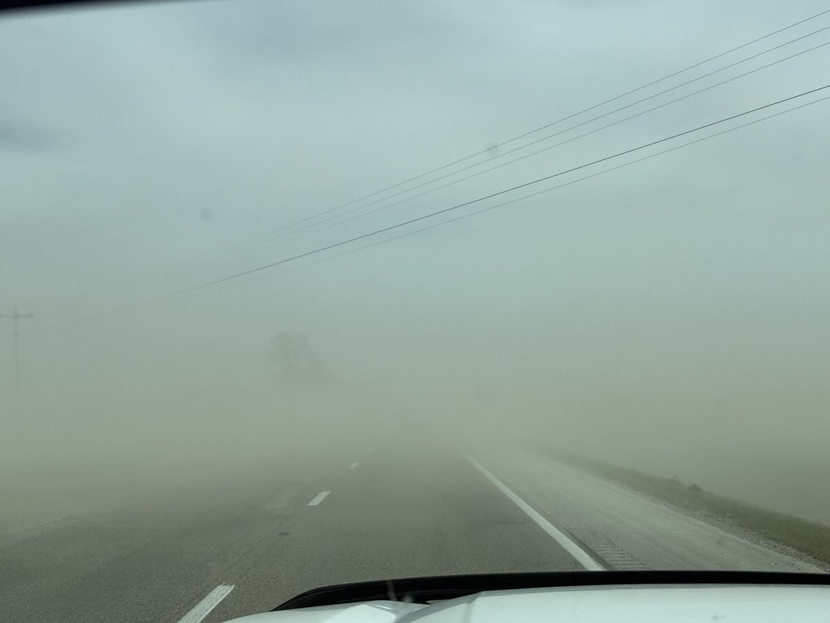 Big time blowing dust across Hwy 63 near Portia. Visibility near zero.