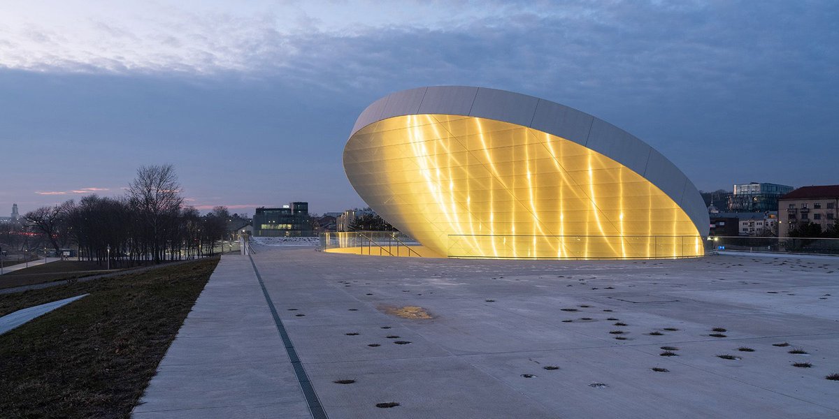 designboom's tweet photo. tilted reflective disk sits atop @SMAR_architects' science island museum in nemunas, lithuania https://t.co/AMoczOwomL https://t.co/Q3beFKd2TD