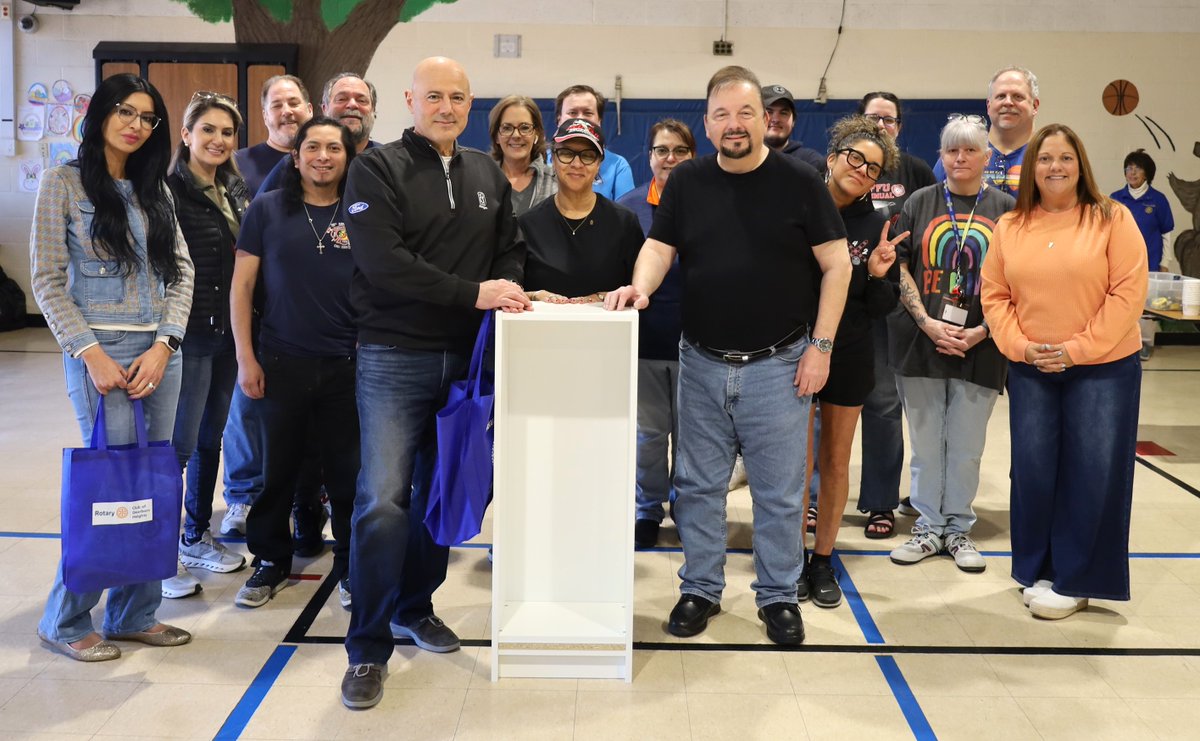 DearHtsRotary's tweet photo. "Many hands make light work" was the unofficial motto of the day at Bedford Elementary School Saturday.  Rotarians and friends gathered for the first of two bookcase building and book bag stuffing events as part of our annual spring literacy drive. #Rotary #serviceaboveself https://t.co/LSR3C8xPmV