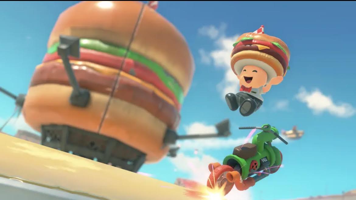 Stealth40k's tweet image. Toad has a Hamburger costume in Mario Kart World. 

Toadette has an Ice Cream costume. 

This is important information.