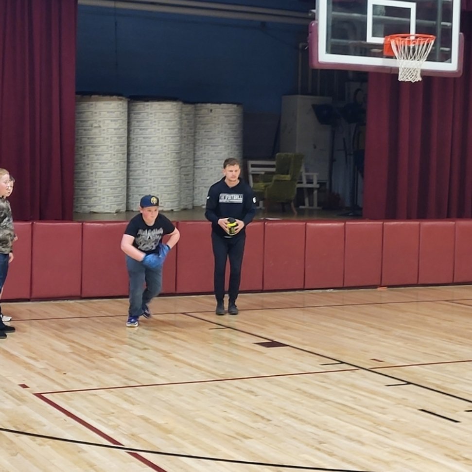 Florence graduates giving back during their Spring break. Current football players, Patrick Duchien (MSU), Jonathan Luhmann (MSU), and Caden Zaluski (Mt Tech), ran 6th graders through stations to assist them in their flag football unit