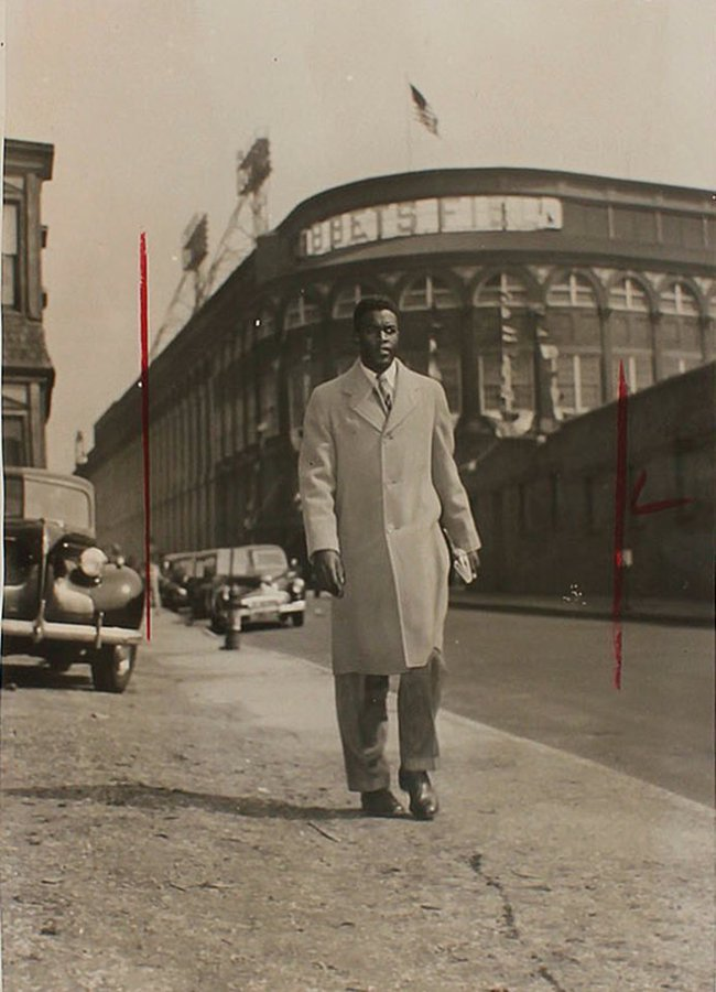 BBGreatMoments's tweet image. Jackie Robinson walks away from Ebbets Field after playing his first MLB game, 1947.