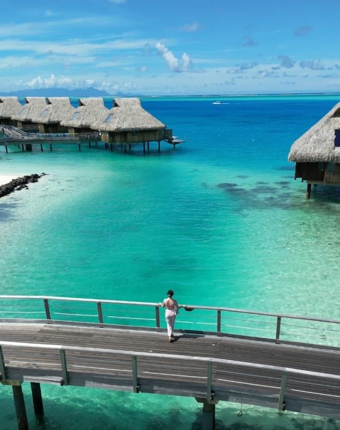 Bora Bora...The islands green rises beautifully against the endless blue of the lagoons..